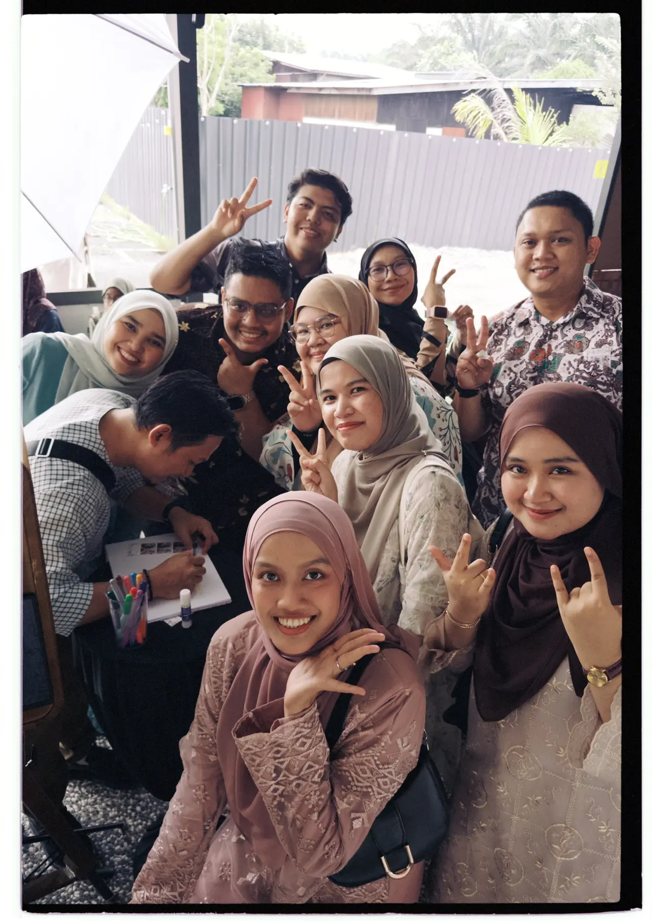 Guests posing together at a firphotobooth setup
