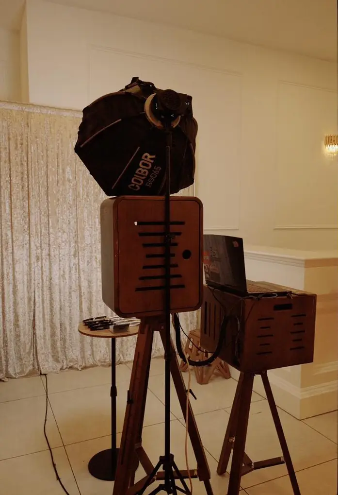 The wooden photobooth camera and backdrop at a venue